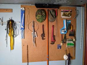 Assortment of Tools and Stuff Pipe Wrench, Broom, Paint Brushes, Hats, and More.&nbsp