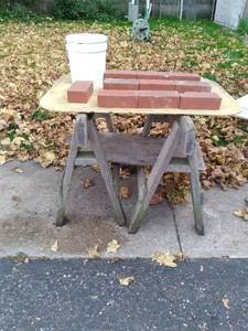Bucket of Sand and (10) Bricks, (2) Wooden Saw Horses