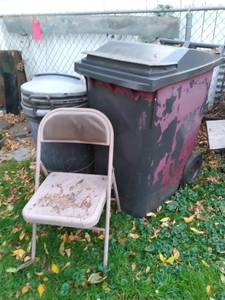 Lot of Covered Garbage Cans on Wheels and a Folding Chair&nbsp