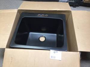 lot 52 image: Wakefield Dual Mount Natural Stone Composite 25 in. 3-Hole Single Bowl Utility Sink in Black by Mont Blanc &nbspCustomer Returns See Pictures 