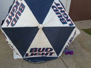 Bud light vinyl patio umbrella with extension pole. As shown.