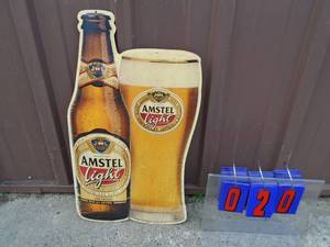 Used Amstel light tin sign. 13 x 22. As shown.