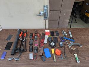 lot 19 image: Vintage Cell Phone and Tool Bundle-A lot of old cell phones  Ice Fishing HT Enterprises Polar Tip-Up Spool Remotes Wire cutters Putty Knives Socket Wrenches And more
