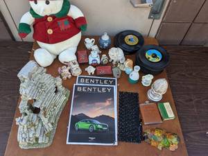 lot 37 image: Home Decor And More Bundle Snowden Plush, Ceramics, 45 Record Albums, Bentley Books, Aquarium Decor, Figurines, And More
