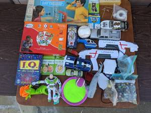 lot 38 image: Fun and Games Bundle- Laser tag, Games, Cars, Buzz Lightyear, Learning Games, And More
