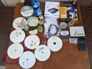 lot 39 image: Crafts and Electronics Bundle-Misc Colored Ribbon, LG Portable Multi-Drive, And More