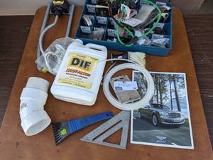 lot 58 image: Tools Supply Bundle, Lawn Sprinkler, Pipe, and More Bundle
