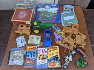 lot 64 image: Vintage Toys-  Lionel Train Videos, Model Car, John Deere Tractor Replica, Wooden Toys and More Bundle