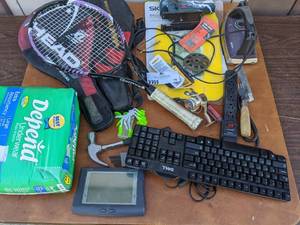 lot 70 image: All The Small Things- Head Racquet Ball Rackets, Depends, Keyboard, Fishing Reel, Drill Bits, Hammer, Allen Wrenches, And More