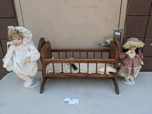 lot 98 image: 1 Vintage Porcelain Dolls and Wooden Toy Cradle