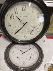 lot 38 image: BULOVA 18 in. H x 18 in. W Outdoor Wall Clock with 2-Step Metal Case