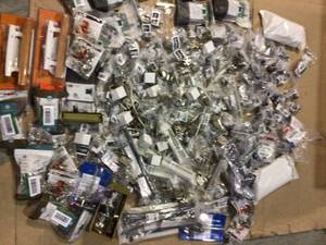 Large lot of assorted door pulls and hardware various brands and models mostly new