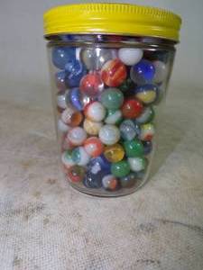 lot 13 image: Old Marbles in Vintage Planters Peanut Jar