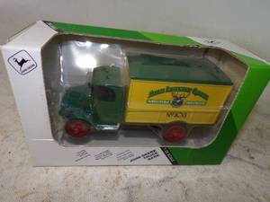 lot 131 image: John Deere Implement Co. Bank New in Box
