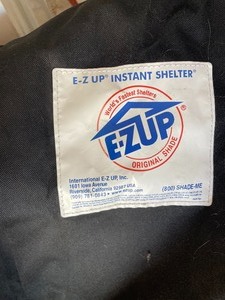 lot 410 image: E-Z Up Instant Shelter