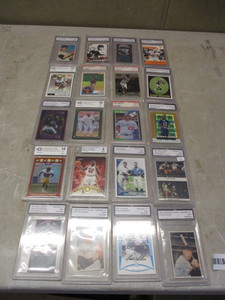 Lot of graded sports cards and magazine clippings