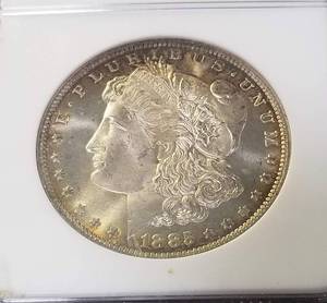 lot 13 image: 1885-O MORGAN SILVER DOLLAR MS65 NGC SHARP FROSTY COIN