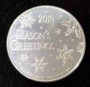 lot 38 image: 1 TROY OZ .999 FINE SILVER CHRISTMAS THEMED ROUND