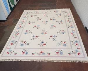 lot 100 image: Knotted Wool Rug