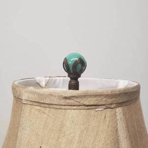 lot 26 image: Stunning Teal Phoenix Glass Lamp