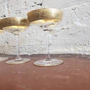 lot 56 image: Elegant Wide Gold Banded Crystal Champagne Glasses