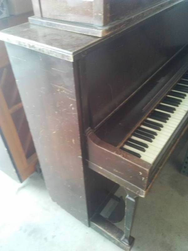 HOWARD upright Piano with bench and mover.