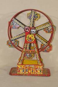 lot 61 image: Antique J Chien & Co Mechanical Pressed Tin Hercules Ferris Wheel Toy