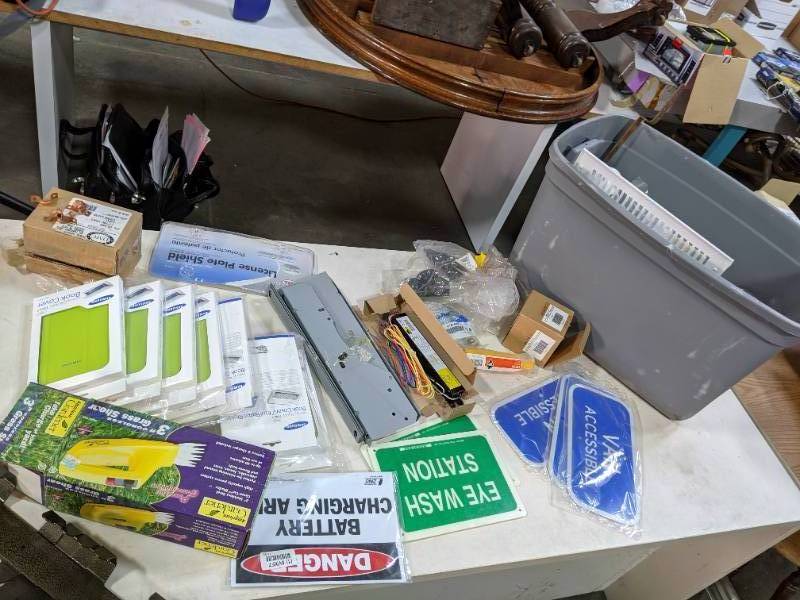 Tabletop and tote full of household...
