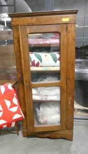 A wonderful colonial cabinet with 4 shelves and glass door. Currently is used as a quilt cabinet.