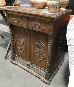 A very unique vintage sewing machine cabinet. Not the traditional look.