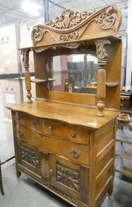 Gorgeous vintage Buffet with wonderful detail on the front along with the wavy contour to the drawers and dramatic mirror top with stately columns.