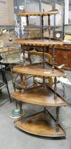 This 5 tier corner shelf with scalloped edges stands 57 tall.  The bottom shelf is 27 wide and the top shelf is 17