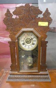 Vintage Waterbury Gingerbread mantel clock with alarm 24 tall 15 wide.  Clock face does have some damage but could easily be replaced. Comes with key.  Untested.