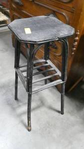 2 small tables or plant stands, one appears to be made from bent tree branches, the other wood table is split down the middle and needs repair