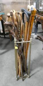 Large group of vintage canes - variety of types of wood, knurl and antler handles all in a stand