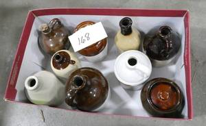shoebox full of miniature crock jugs in good condition