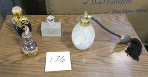 Group of toiletry items, atomizer and perfume bottles