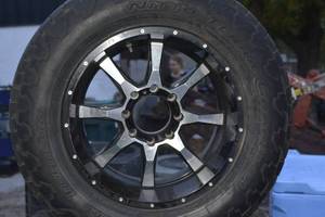 4 tires and rims one Is a different color than the rest