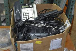 box full of vaious electronics and cables