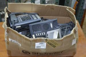 box full of business desk phones