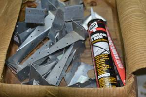2 boxes of various building materials