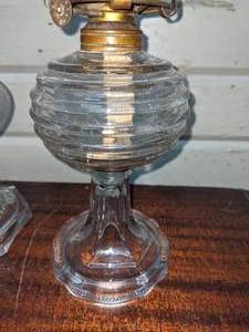 lot 114 image: 2 Clear Glass Oil Lamps