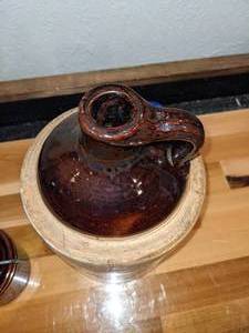 lot 121 image: Antique Stoneware Whiskey Jug & Butter Crock wWire Bail Top