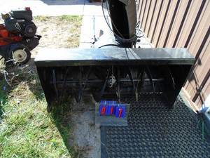 MTD mounted snow blower with pulleys, brackets & manual. Very good used condition. 44 x 21. As shown.