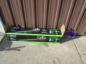E-Go 56 volt 24 hedge trimmer with charger. No battery. Appears new in box. As shown.