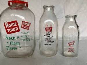 lot 103 image: Vintage Milk Bottles with local connection