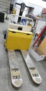 lot 1 image: Yale 12V electric pallet jack 4000# capacity (works), with a battery charger but needs a different end put on it
