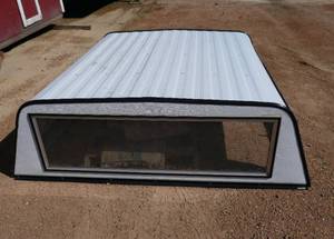 lot 7 image: Very nice Unicover aluminum pickup topper, windows on all sides, none are cracked or broken, 72L x 68w x 23t, came off a Chevy