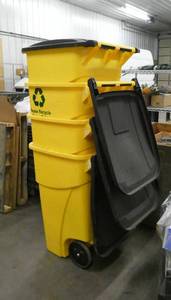 lot 11 image: Stack of 4 very nice 30 gallon trash cans with wheels and lids