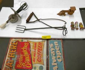 lot 45 image: Vintage beater, a strange fork and a Kemps Ice Cream bucket tongs, some small occupied Japan figures, a hand made train and a tin sign to Eat Here